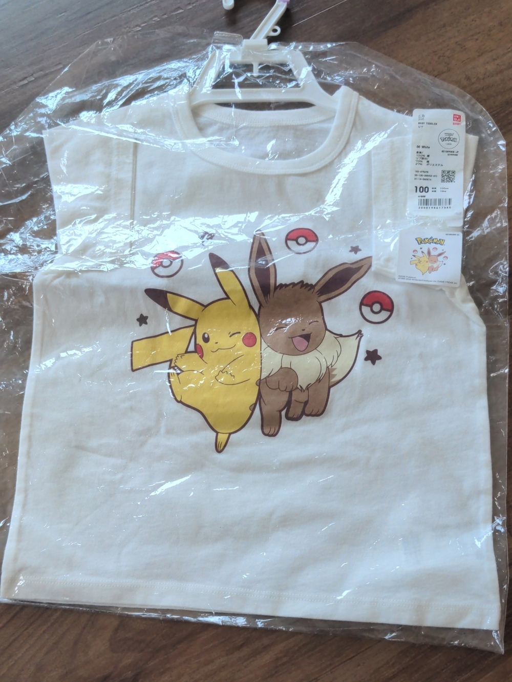 Uniqlo Cream Kids T-Shirt with Pikachu & Eevee Graphic